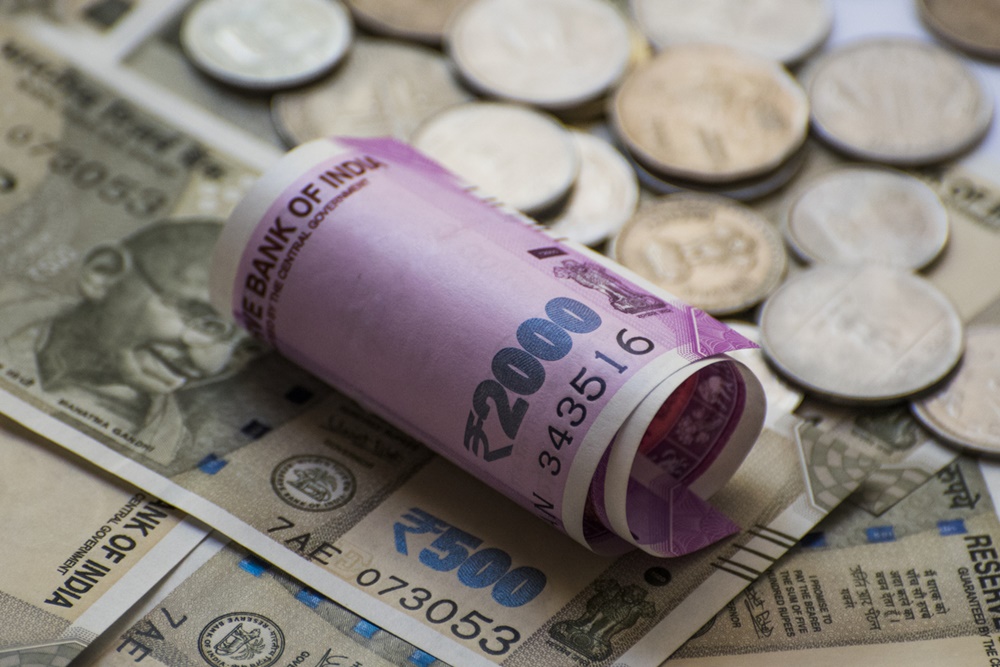 Rupee Slumps 76 Paise, Settles Below 74/USD