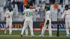 Pakistan's Naseem Shah, center, celebrates with teammates after taking the wicket of Australia's Alex Carey during the 4th day of the first test match between Pakistan and Australia at the Pindi Stadium, in Rawalpindi, Pakistan.
