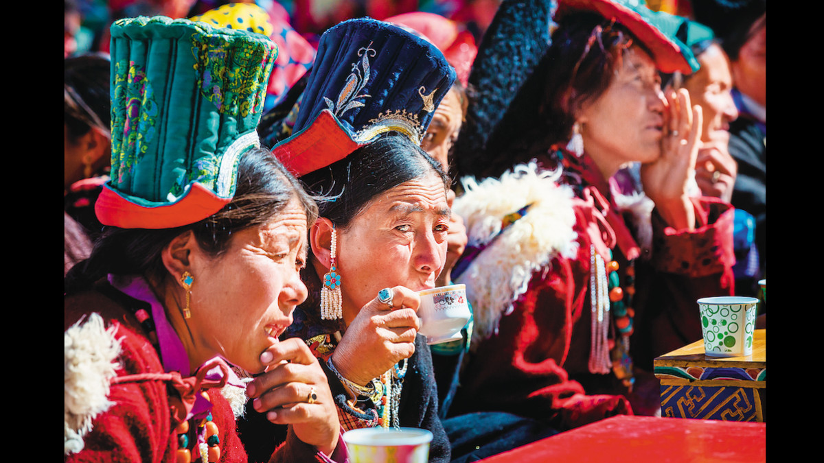 Locals cherishing their yak butter tea Locals cherishing their yak butter tea